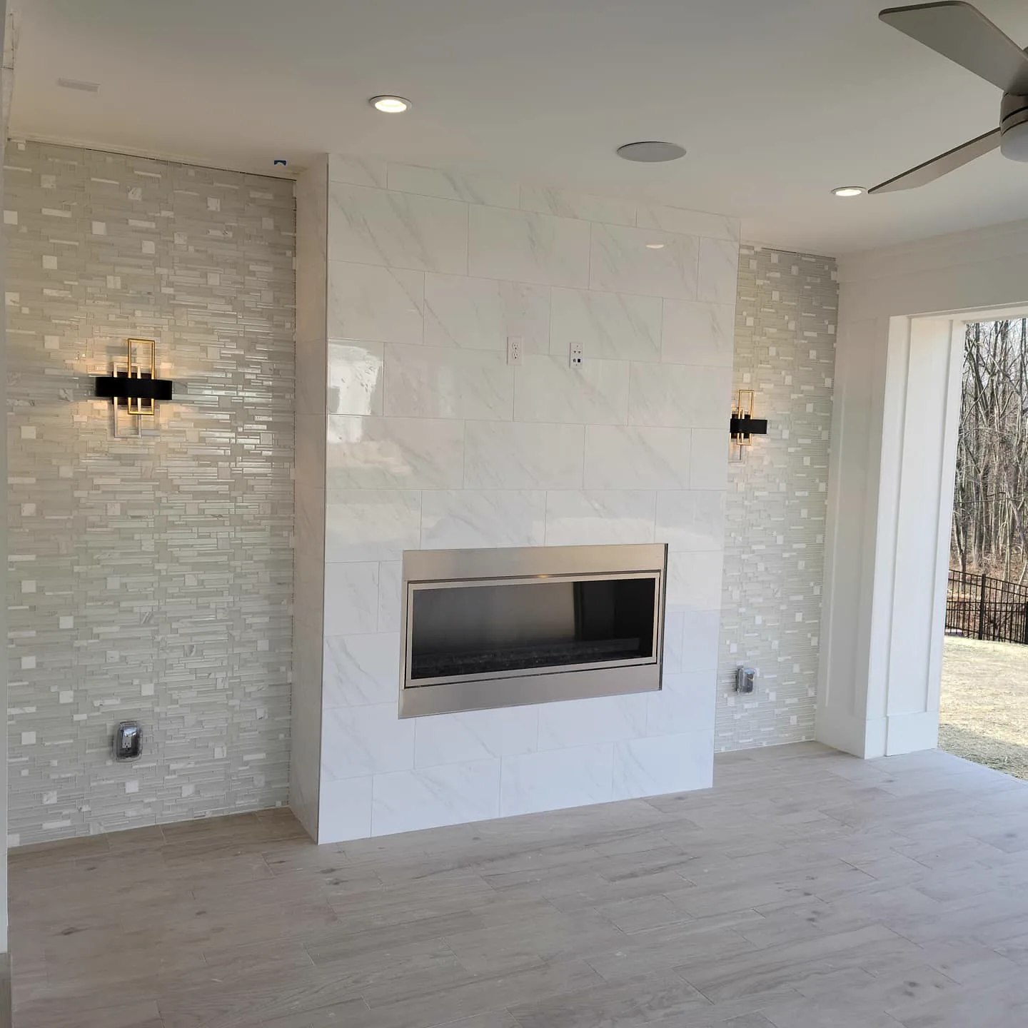 White subway tile fireplace surround with TV niche
