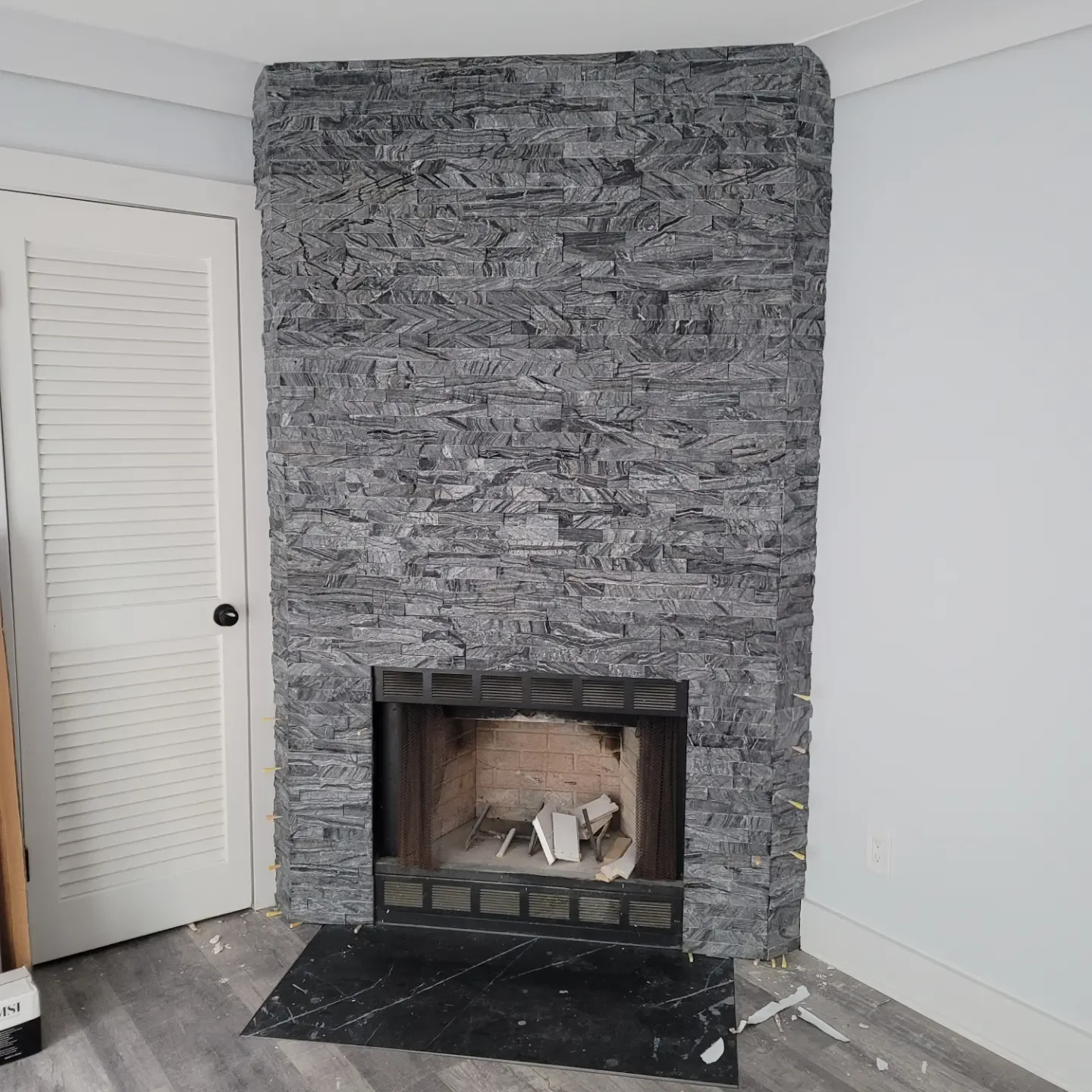 Stacked stone fireplace surround